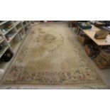 A Chinese cotton carpet, decorated in pastel colours with floral and border designs approx.