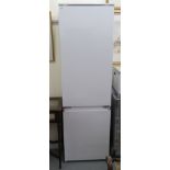 A Smeg integrated 70/30 fridge/freezer 70''h 21''w LSM