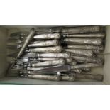 A matched set of eighteen stainless steel dessert knives and forks,
