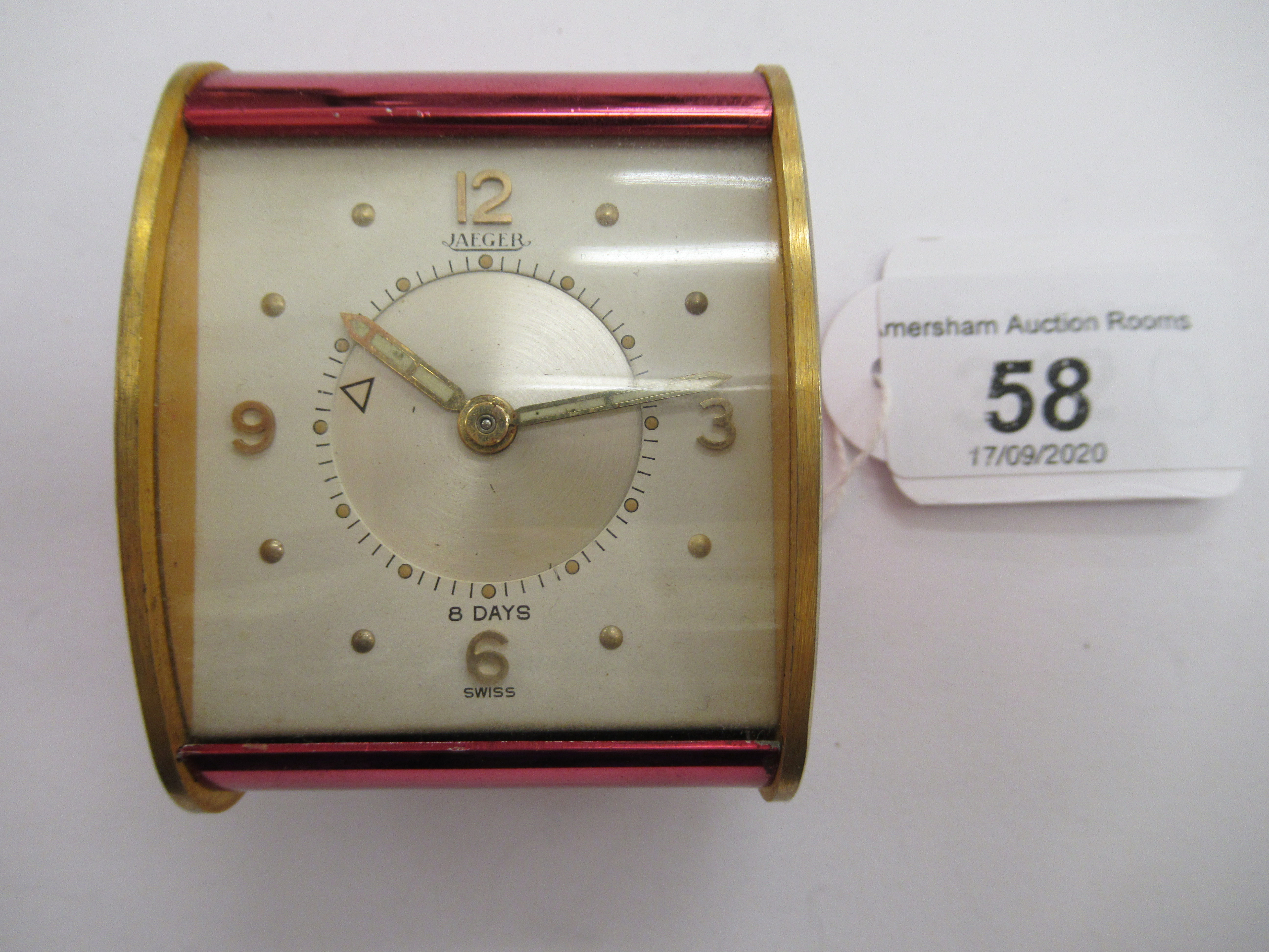A 1980s brass cased Jaeger travel timepiece;