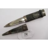 A Scottish dirk, the horn and white metal handle bears a crowned ER insignia, carved with studded,