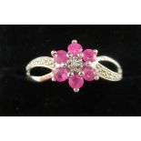 A silver floral design dress ring,
