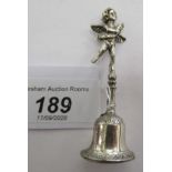 A miniature silver bell,