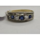 A gold coloured metal and platinum set sapphire and diamond ring 11