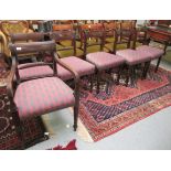 A harlequin set of six Regency and later mahogany framed bar back dining chairs,