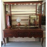 An early 19thC county made, crossbanded oak dresser, the superstructure featuring open shelves,