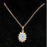 An 18ct gold claw set opal and diamond pendant,