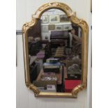 A modern cream and gilt painted mirror,