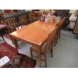 A 1980s crossbanded American black walnut refectory table, raised on square,