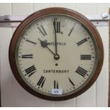 An Edwardian mahogany cased wall timepiece with a turned surround;