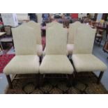 A set of six modern cream coloured fabric upholstered dining chairs, raised on square,