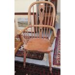 A 20thC Windsor beech and elm framed hoop, splat and spindled back, open arm chair,