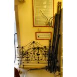 A late Victorian cast iron and later black painted metal framed four poster bed frame,