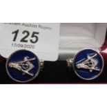 A pair of silver cufflinks,