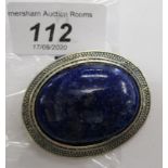 A silver oval framed brooch,