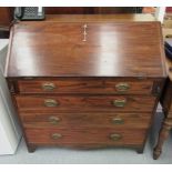 An early 19thC mahogany bureau, the fall flap enclosing a fitted interior,