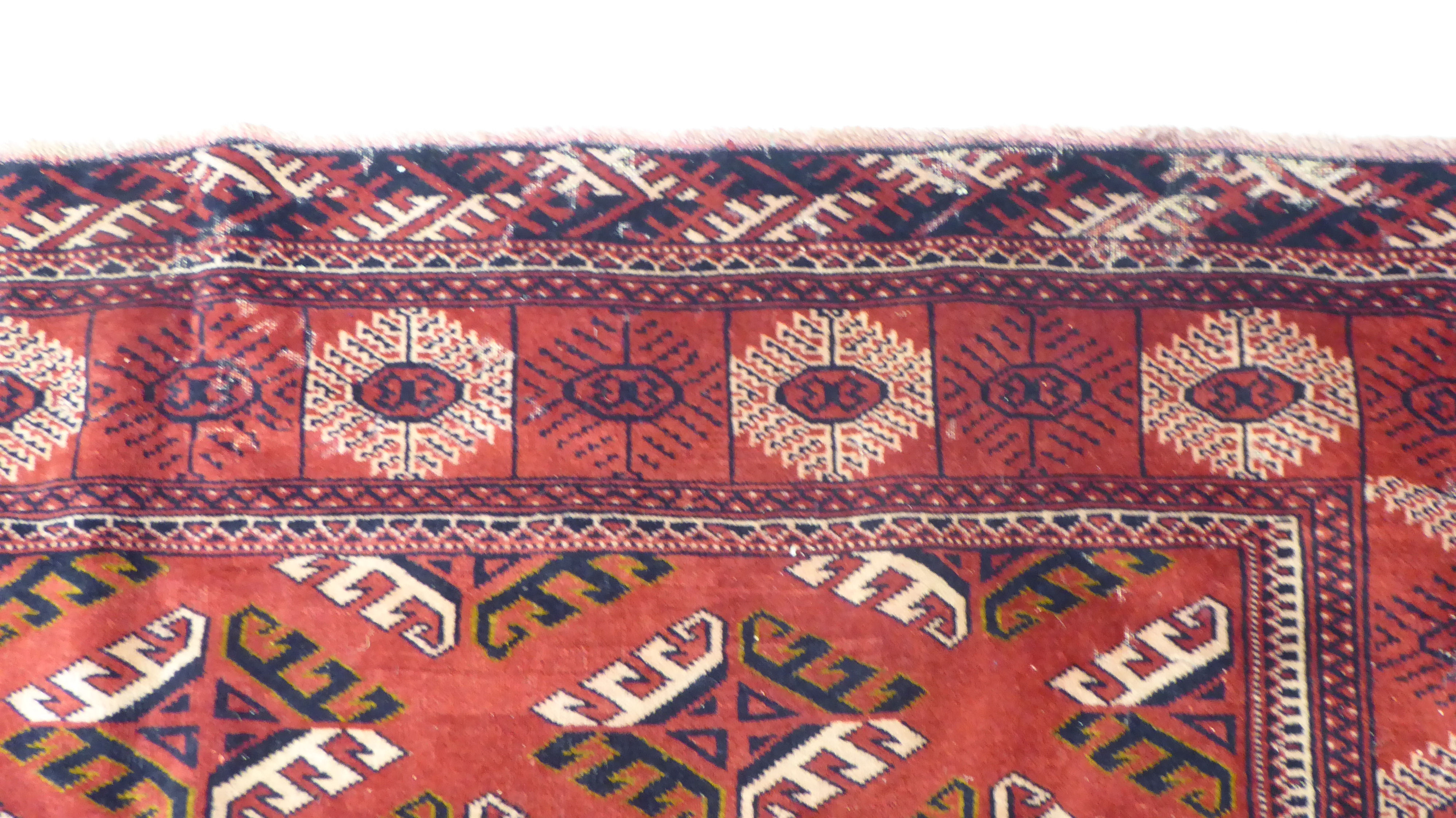 A Turkoman carpet, decorated with repeating stylised designs, - Image 3 of 4