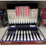 A set of twelve early 20thC silver plated dessert knives and forks,