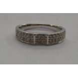 A 9ct white gold diamond set wedding ring boxed 11