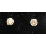 A pair of diamond stud earrings boxed 11