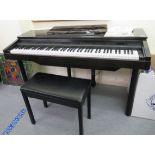 A Yamaha Clavinova CVP-10 electric piano 32''h 54''w with a stool and instructions RSF