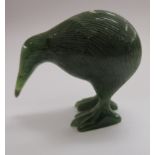 A carved green stone model,