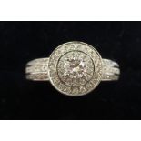 A 9ct white gold diamond set halo design ring boxed 11