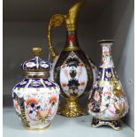 Three pieces of Royal Crown Derby china: to include a ewer 10.