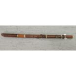 A woodwind instrument with turned ivory ferrules 24''L BL