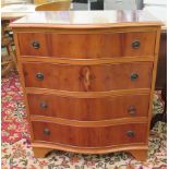 A modern yewwood serpentine front four drawer dressing chest,