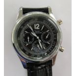 A stainless steel wristwatch, faced by various dials,