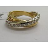 An 18ct bi-coloured gold and diamond set crossover ring 11