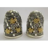 A pair of novelty silver plated condiments pots,