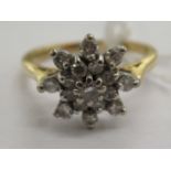 An 18ct gold claw set diamond cluster ring 11
