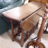 A George II country made oak drop leaf table,