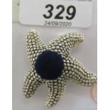 A silver novelty starfish design pin cushion 11