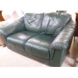 A modern Chesterfield style two person settee, upholstered in soft, bottle green hide,