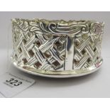 A silver plated bottle coaster of faux woven cane design,