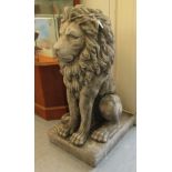 A composition stone seated heraldic lion,