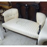 A late Victorian/Edwardian showwood framed two person salon settee,