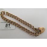 A 9ct gold curb link bracelet with a heart shaped clasp 11