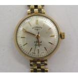 A lady's Rotary 9ct gold cased wristwatch, faced by a baton dial,