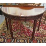 A mid 20thC 'antique' inspired mahogany demi-lune hall table with neo classically inspired and