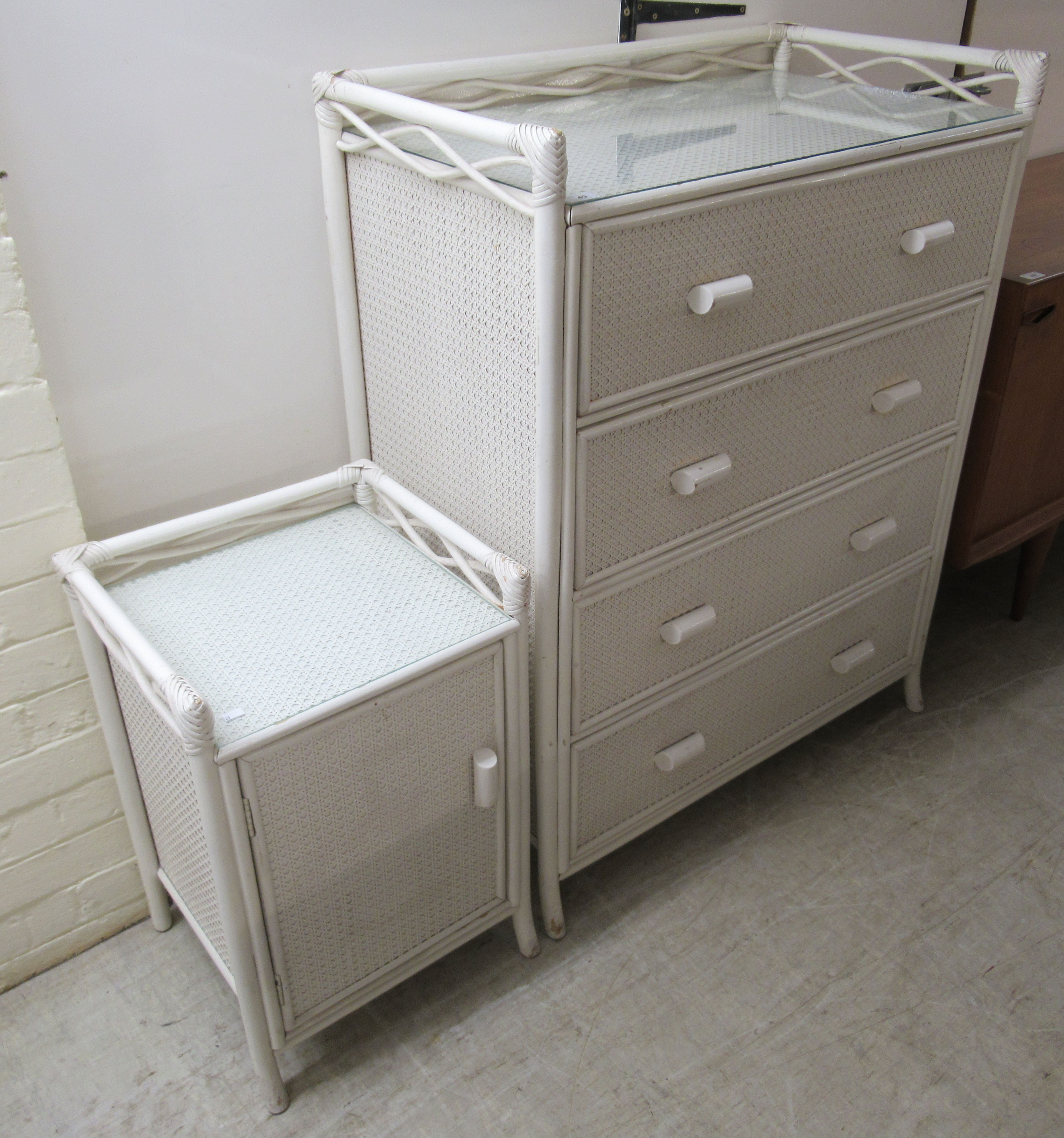 A 20thC white painted woven split cane covered four drawer dressing chest,