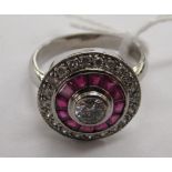 An 18ct white gold diamond and ruby set ring 11