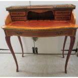 A lady's modern Continental style string inlaid kingwood finished writing bureau with a low