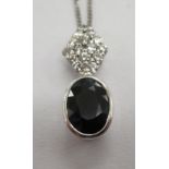 An 18ct white gold sapphire and diamond set pendant,