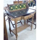 An early 20thC pine washstand, the marble top between two towel rails, over a frieze drawer,