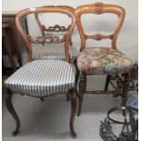 A pair of mid Victorian mahogany framed, carved bar back chairs,