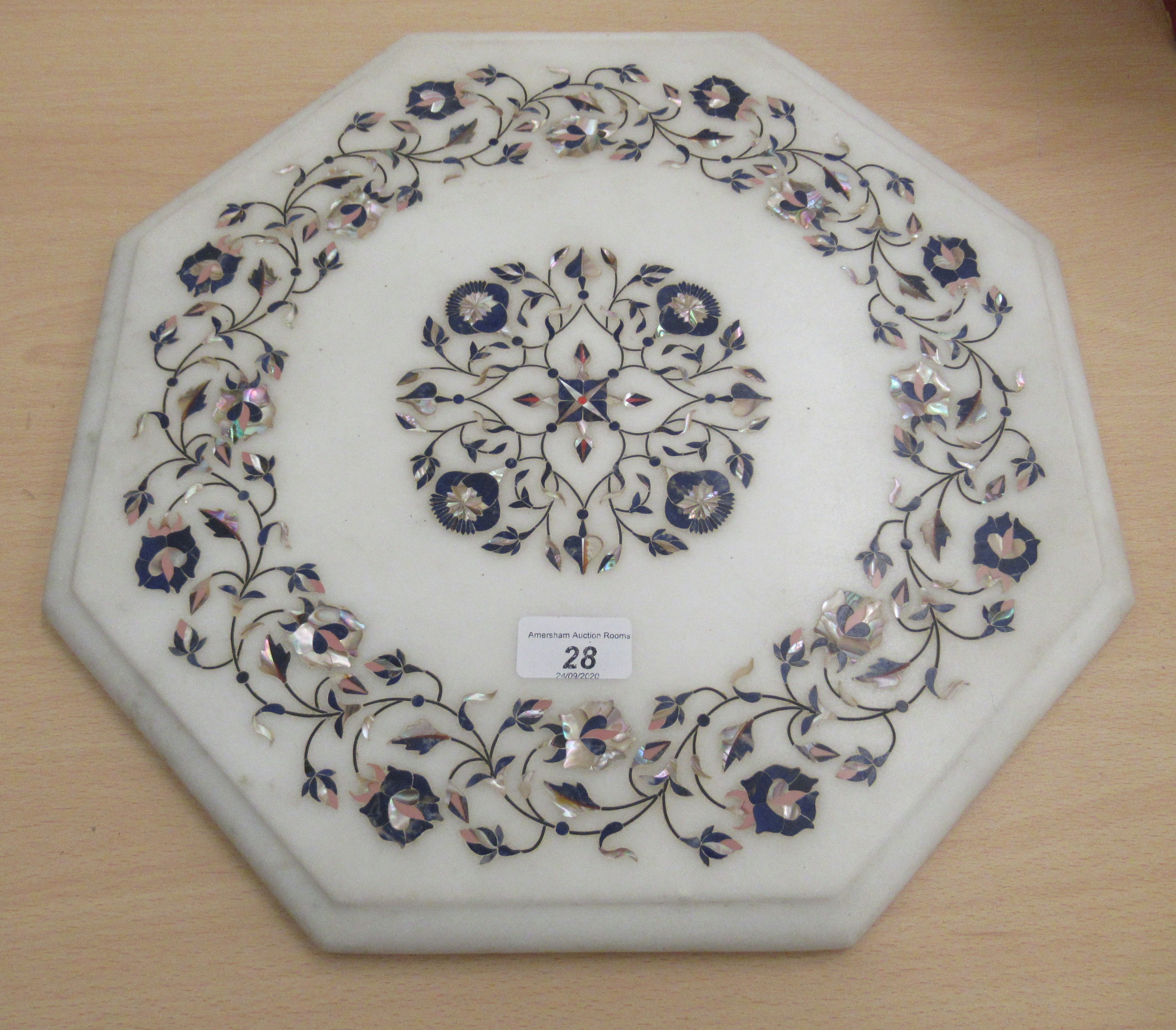 A 20thC pietra dura marble table top of octagonal form, decorated with flora,